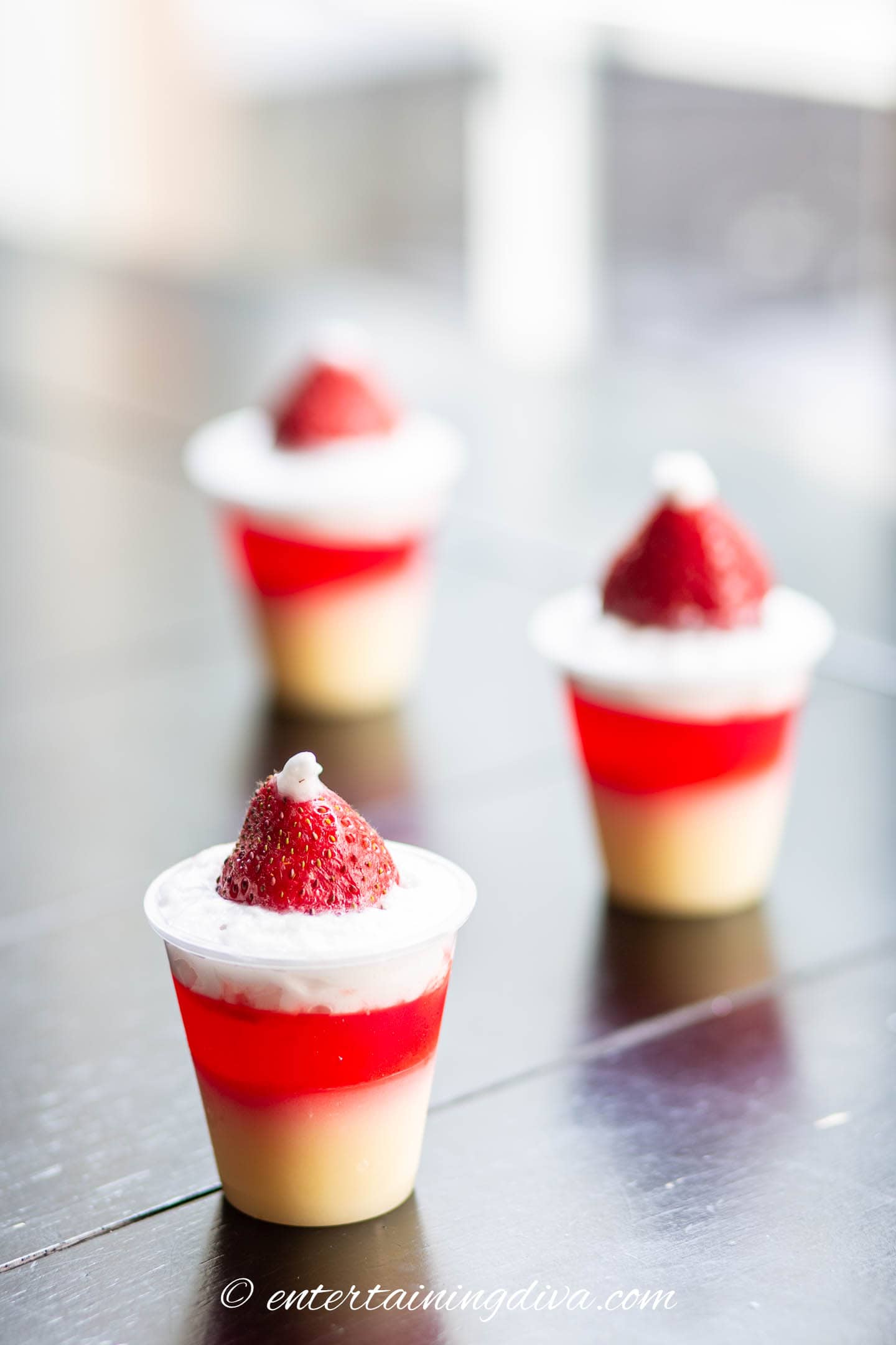 strawberry shortcake jello shots that look like Santa hats