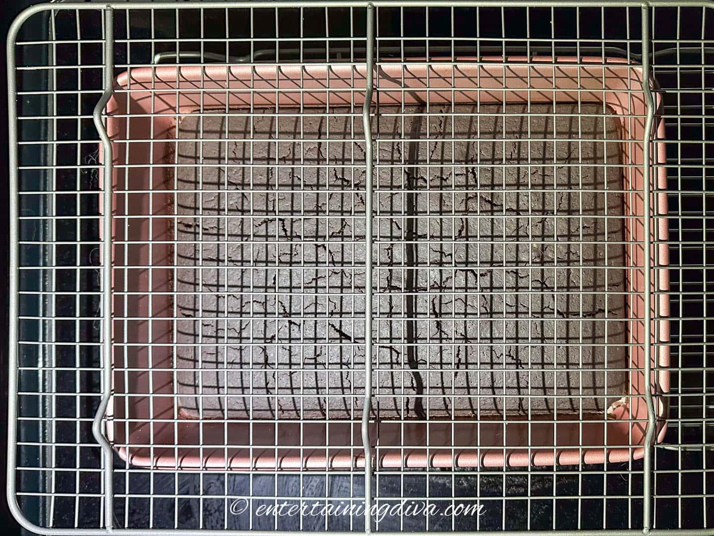 cooling rack on top of a cake in a pan