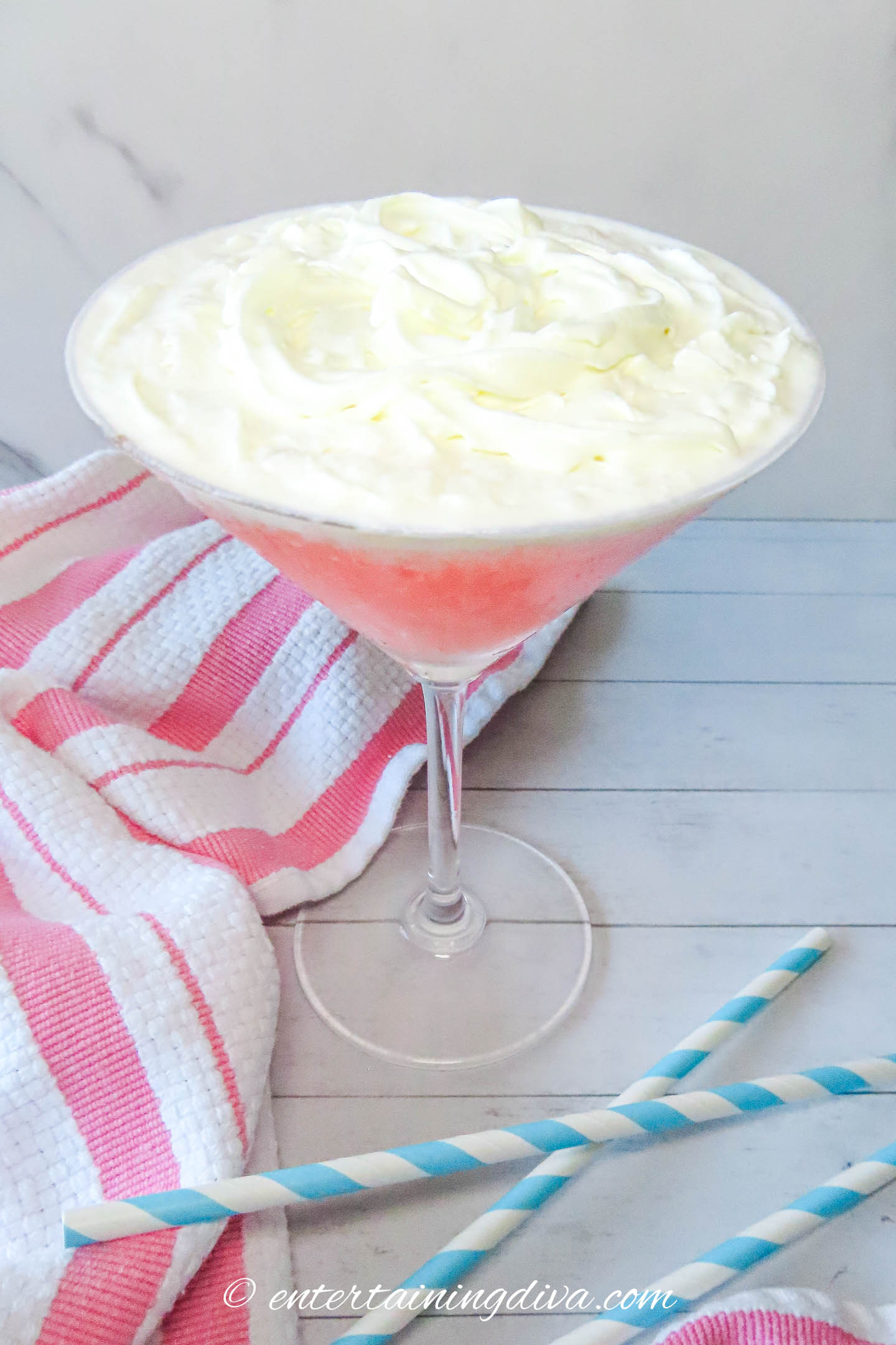 guava martini after whipped cream has been added to the top of it