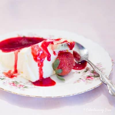 a slice of frozen lemon mousse with raspberry sauce