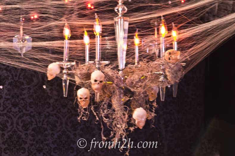 Spanish moss and skulls add spookiness to your chandelier