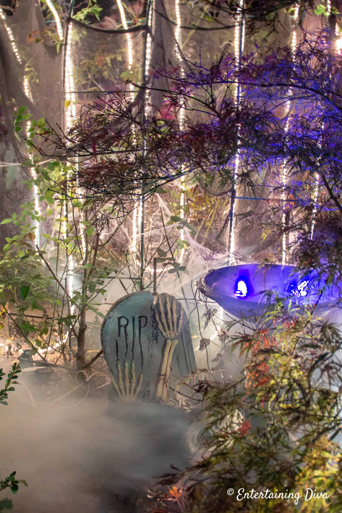Fog swirling around a Halloween grave stone