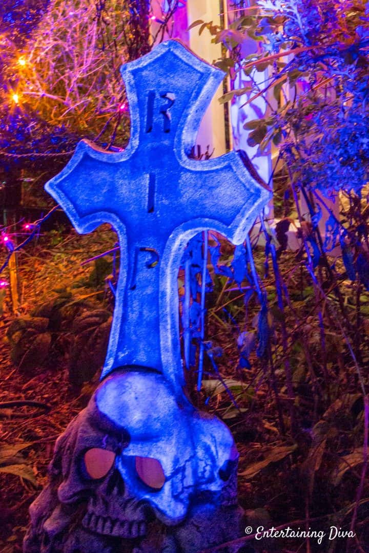 RIP Halloween gravestone highlighted with blue spotlight