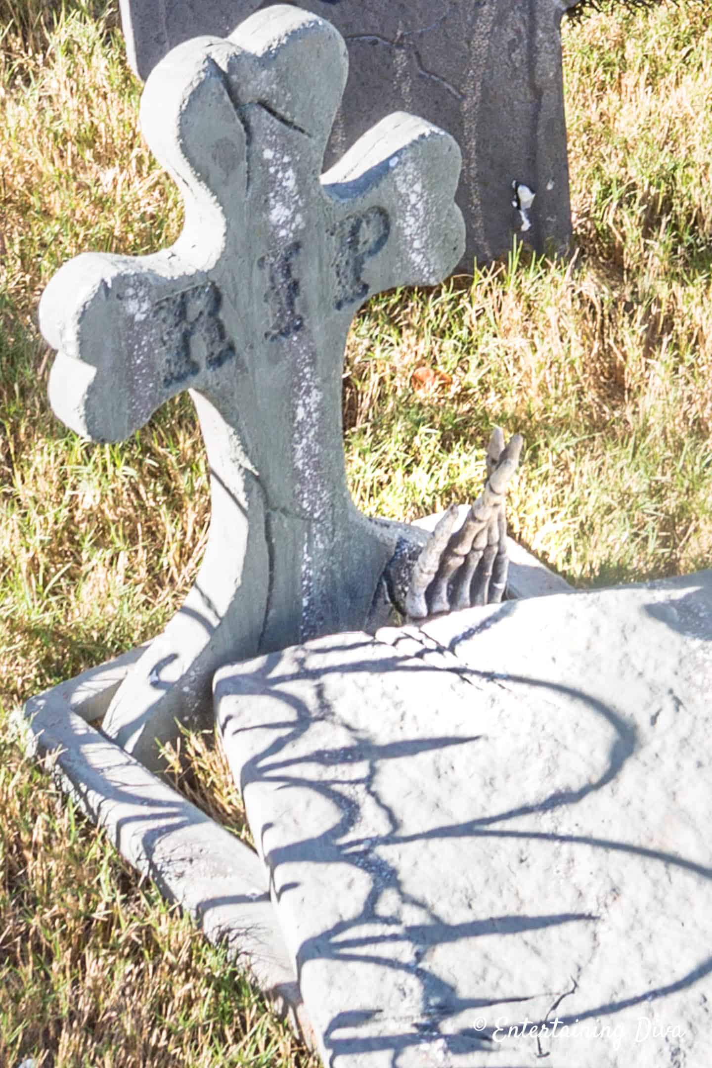 Skeleton hand coming out of Halloween grave