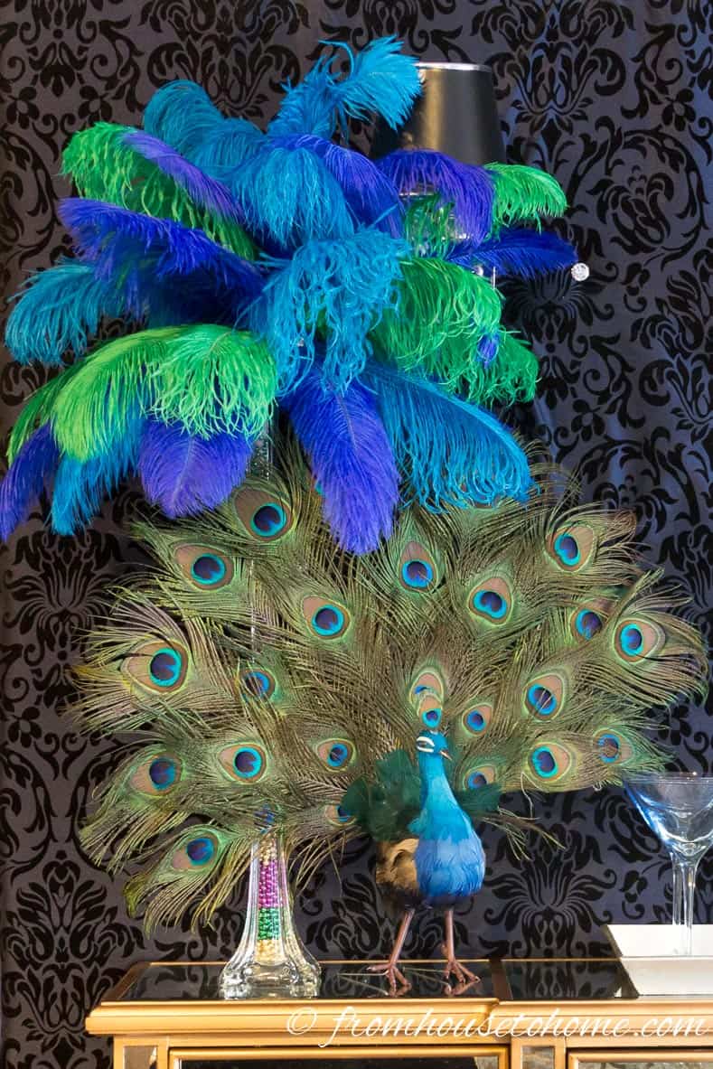Peacock feather centerpiece with blue, green and teal ostrich feathers