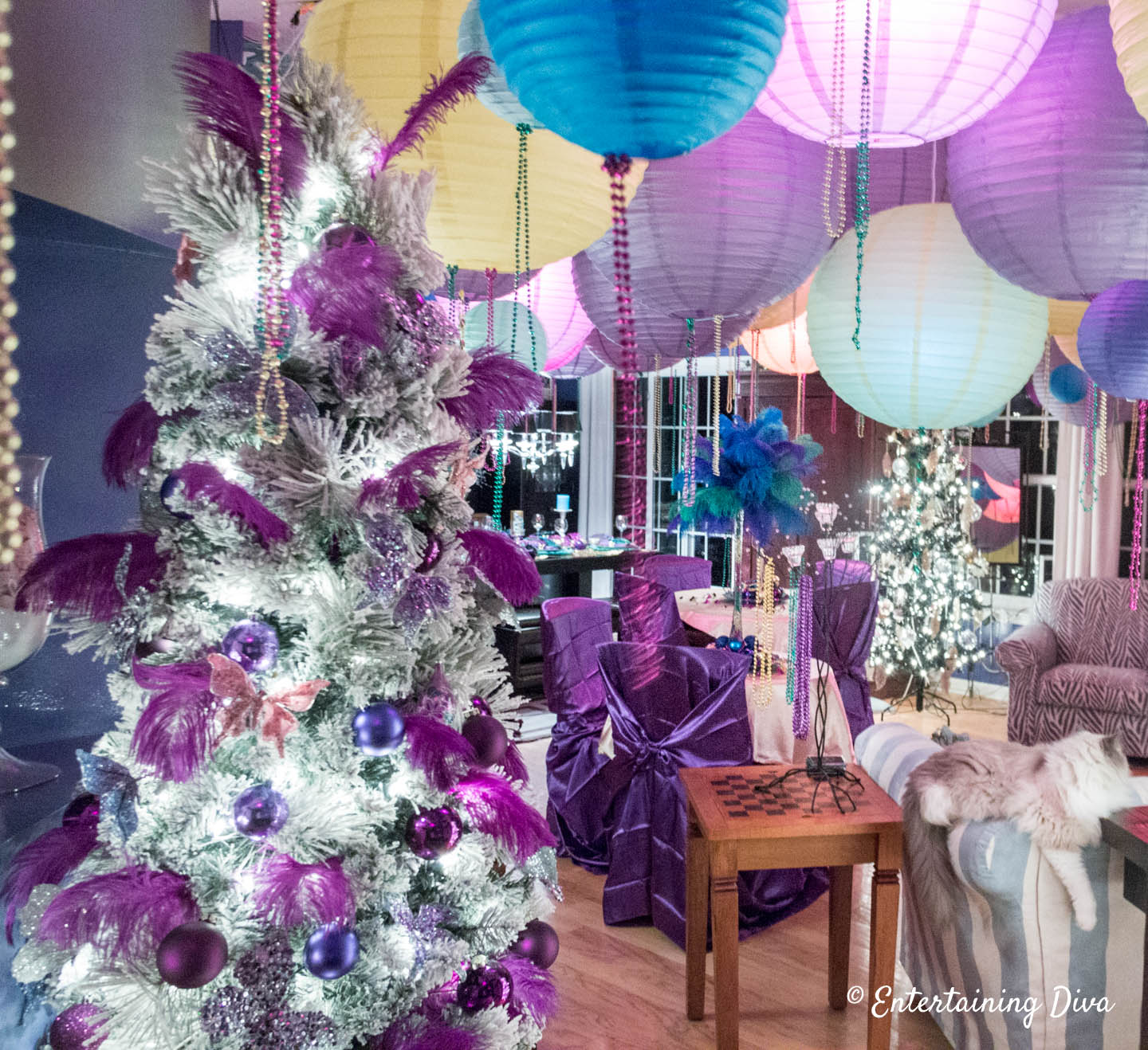 Mardi Gras Christmas tree decorations with purple feathers