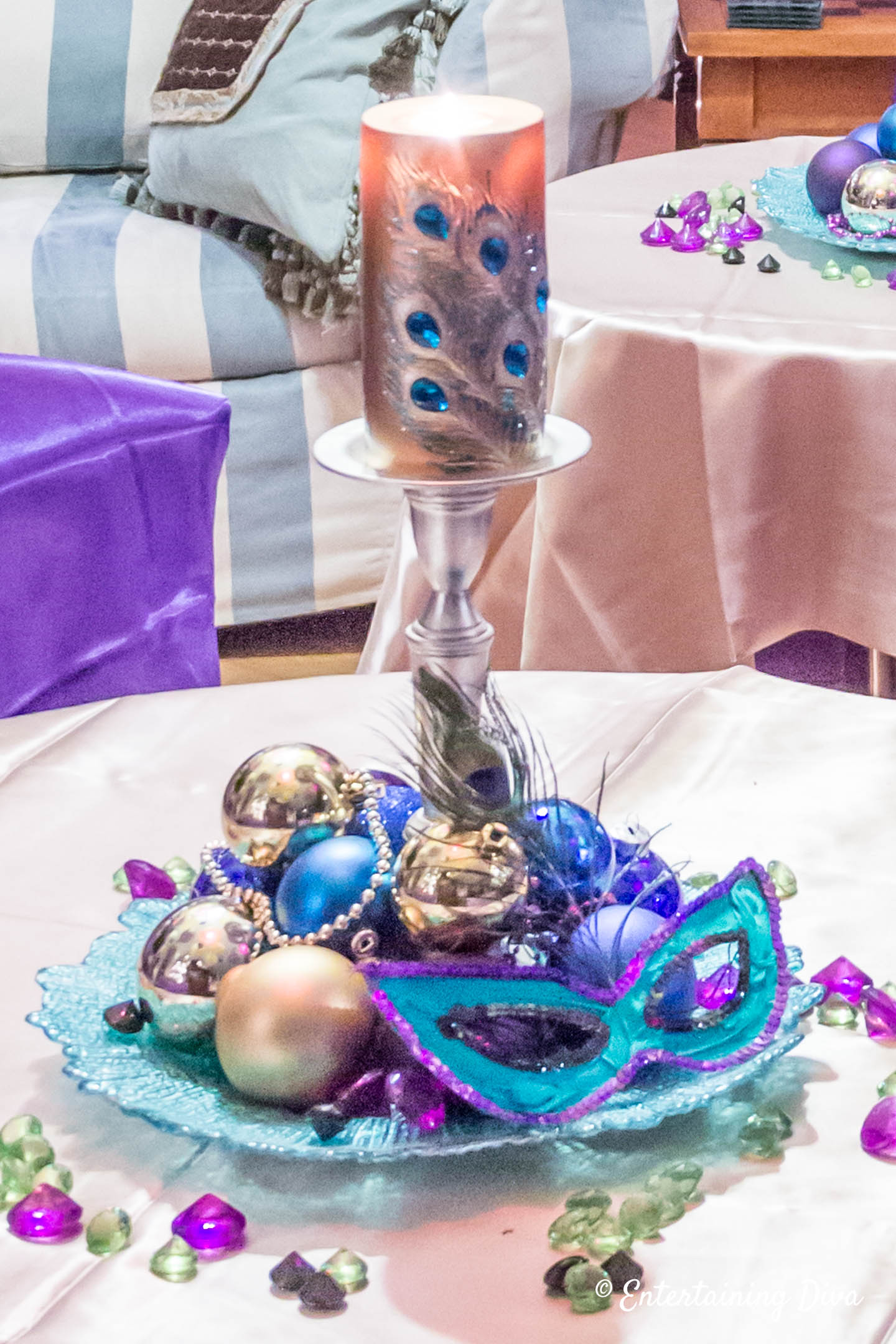 Mardi Gras table decorations with mask, ornaments and beads