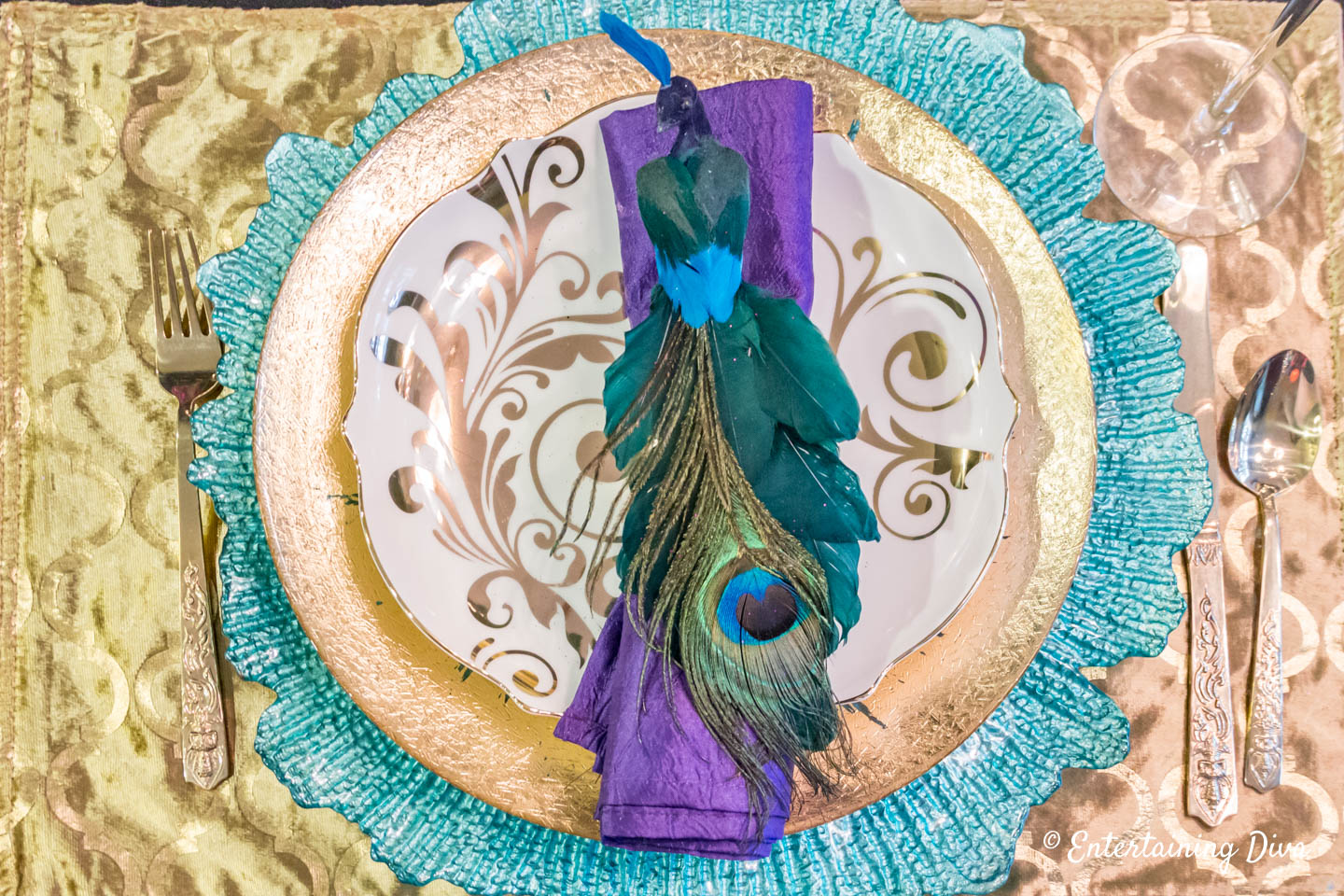 Mardi Gras tablescape with peacock napkin ring