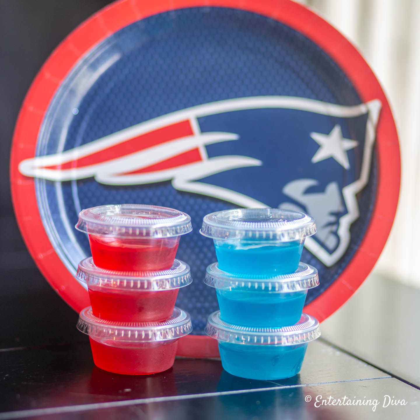 Red and blue jello shots with a New England Patriots plate in the background
