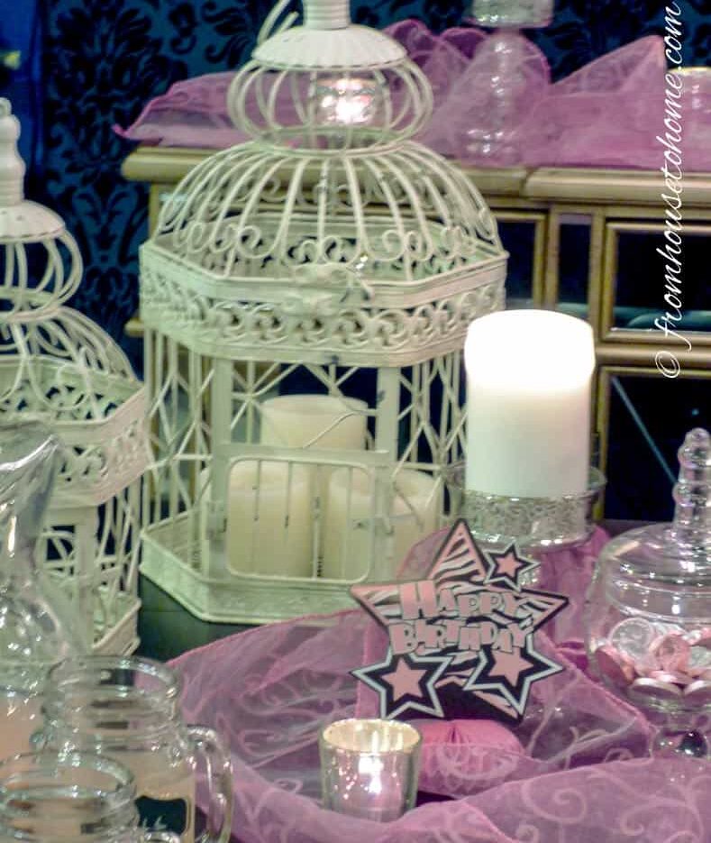 White bird cages with white candles
