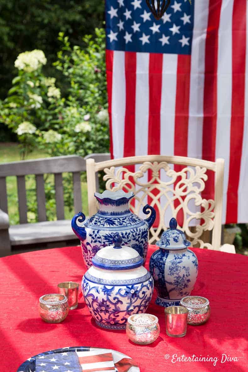 Blue and white vases with a red tablecloth are another way to create July 4th patriotic decor