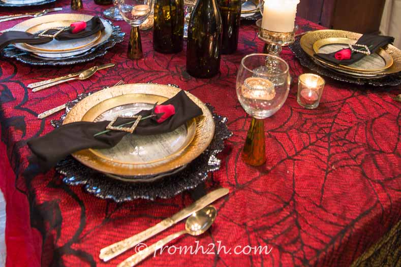 Red Tablecloth With Black Lace Overlay at a Phantom of the Opera party