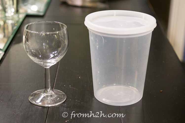 Find a container that is at least as tall as the wine glass | DIY Santa Wine Glasses