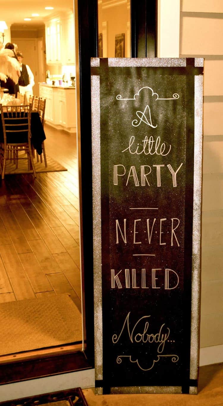 A little party never killed nobody entrance sign at a Great Gatsby party