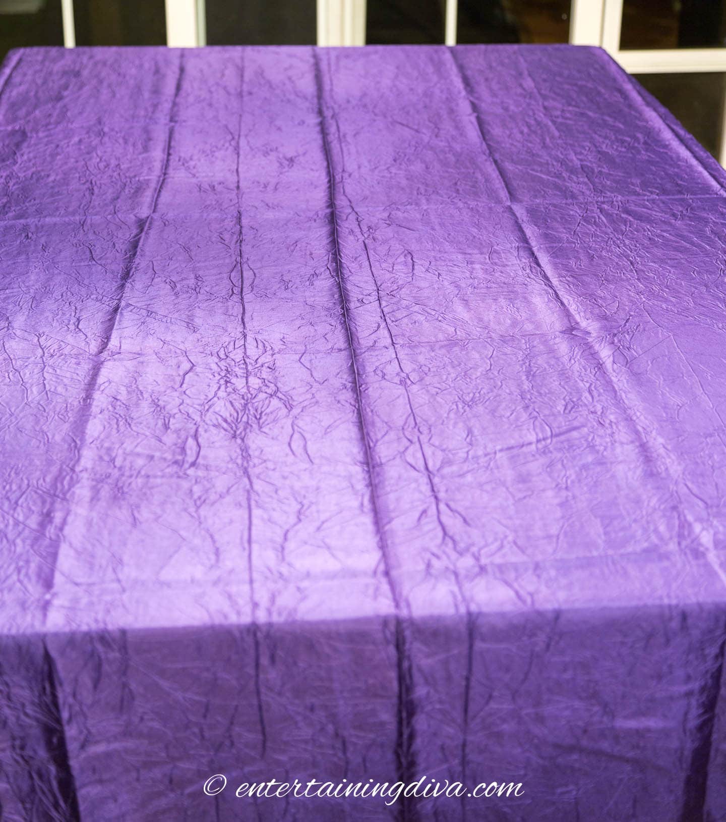 Purple tablecloth on a table
