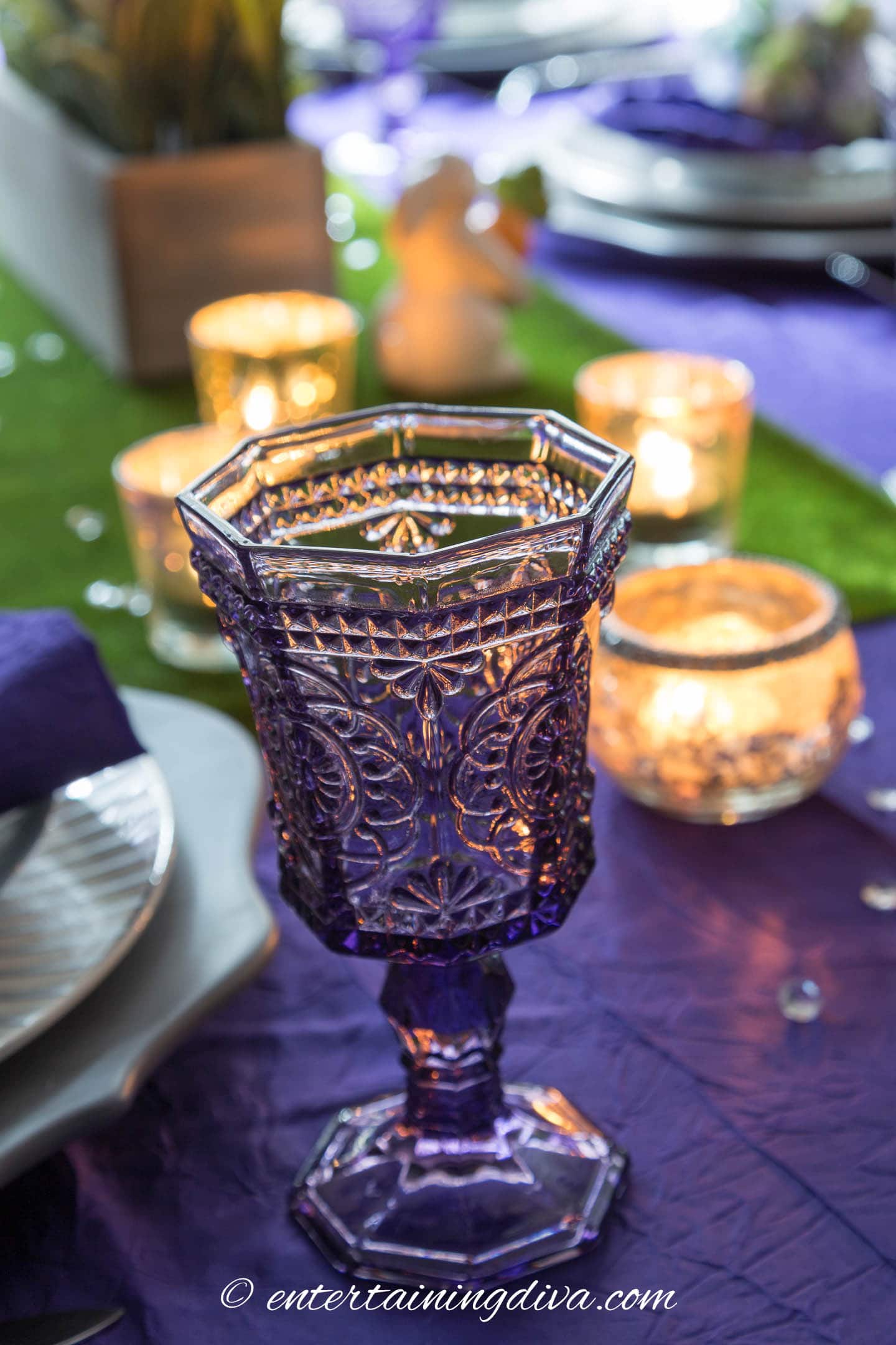 Purple stemmed glass on a purple and green Easter table