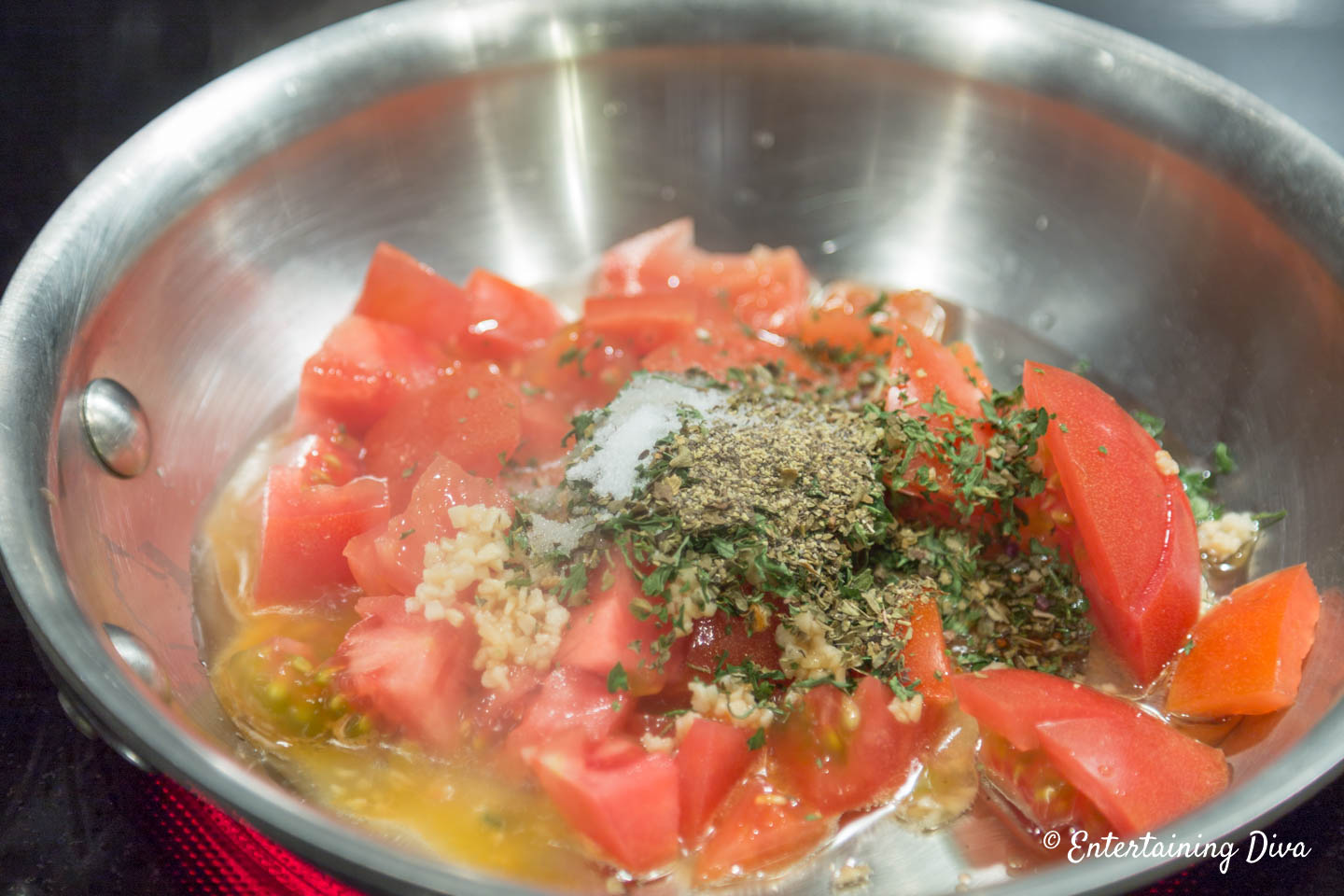 Tomatoes, garlic and spices in a small skillet