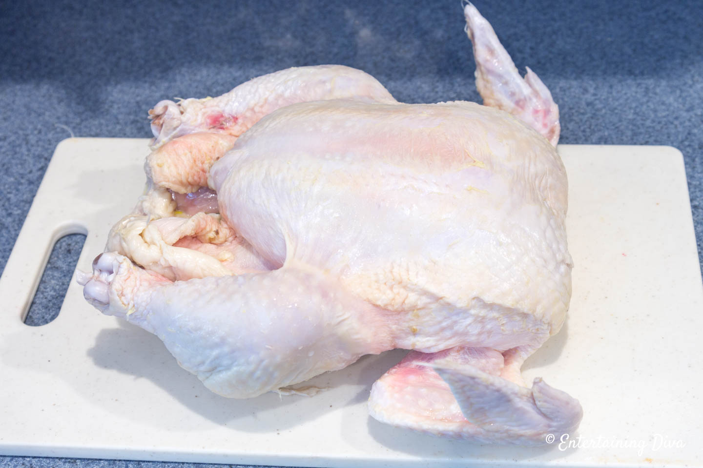 Whole chicken on a cutting board