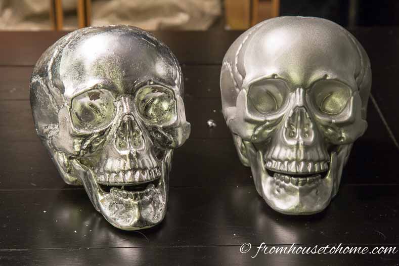 Two skulls - one covered with silver leaf and one painted with silver spray paint
