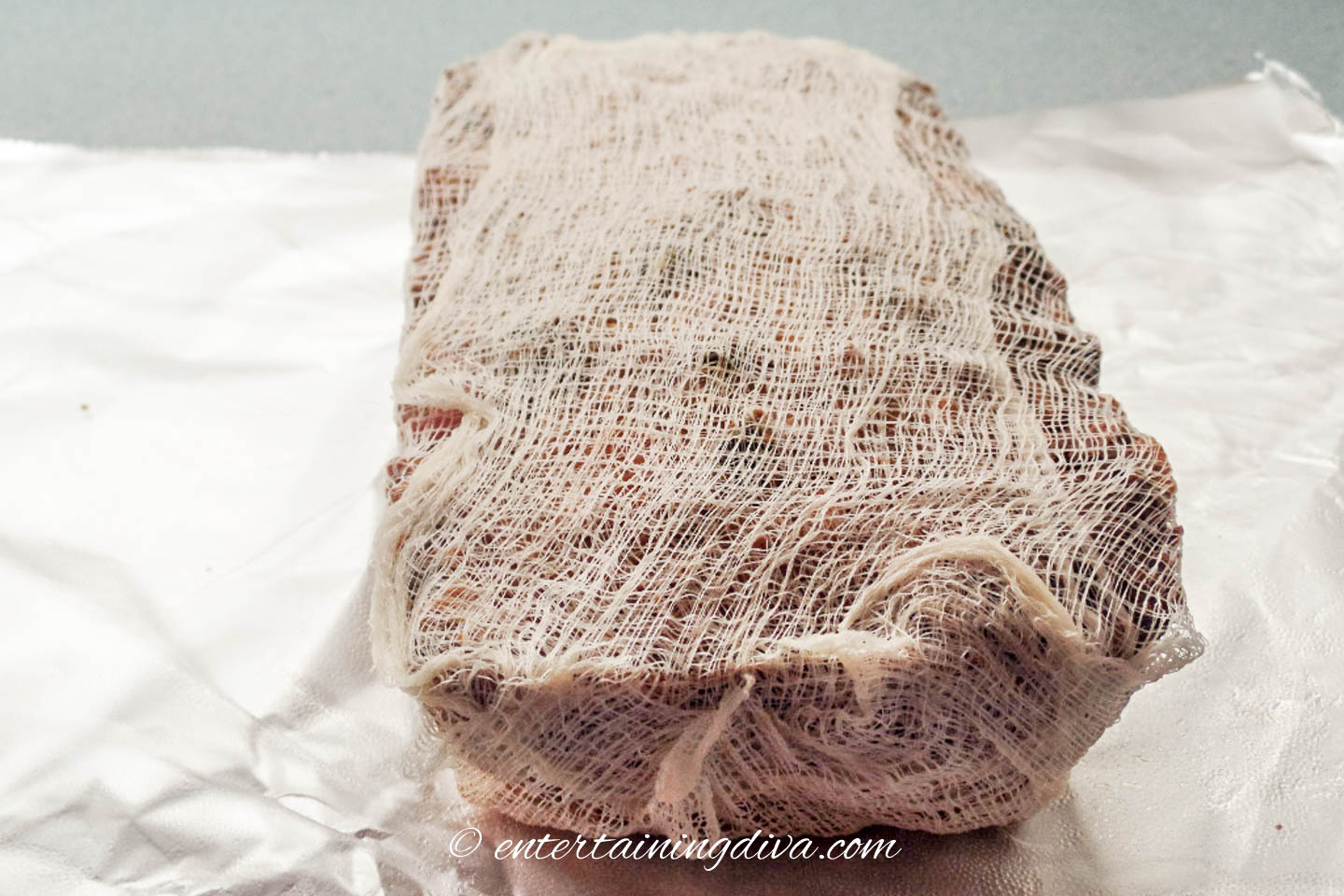 Christmas fruit cake wrapped in rum-soaked cheesecloth