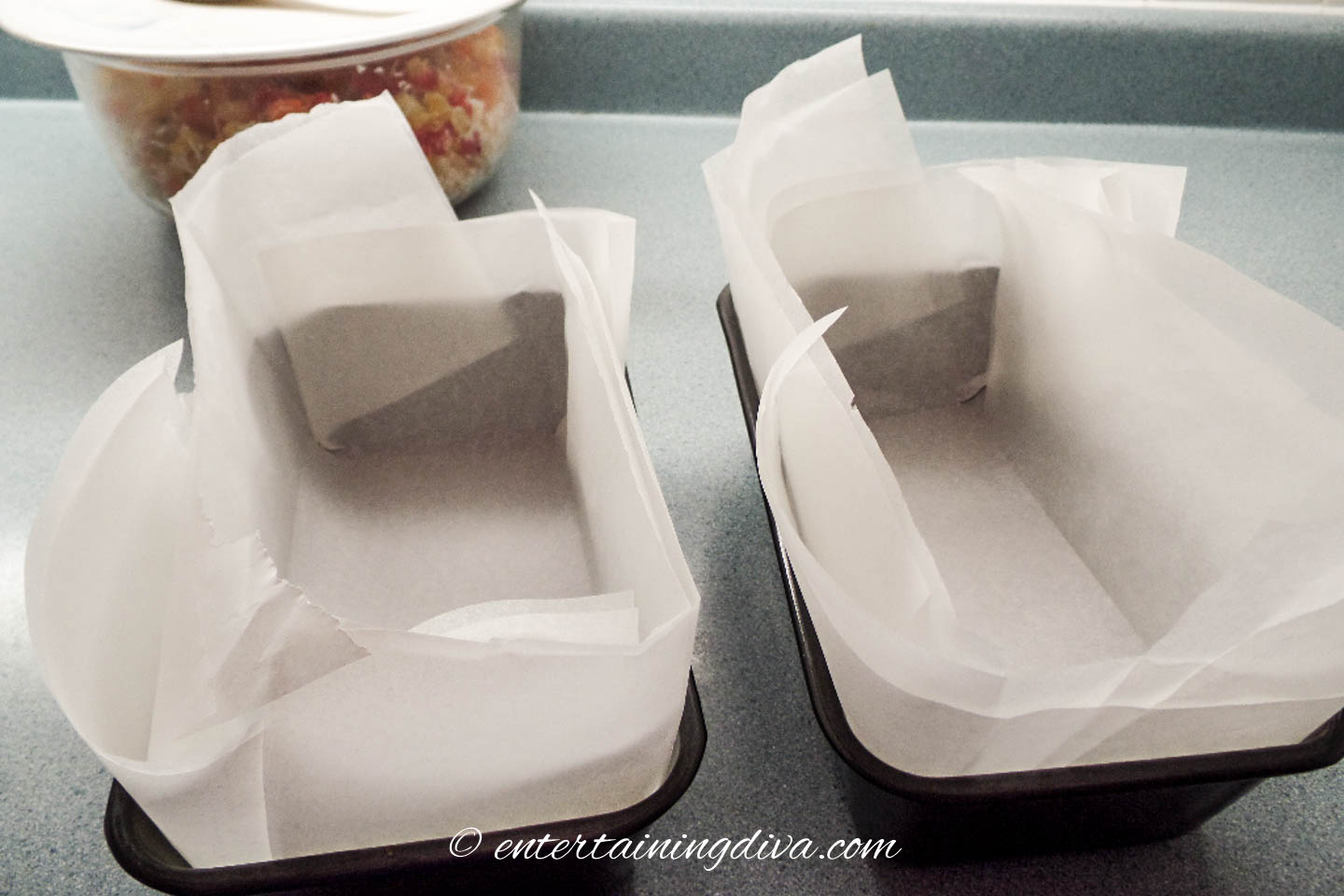Fit the parchment paper into the pans