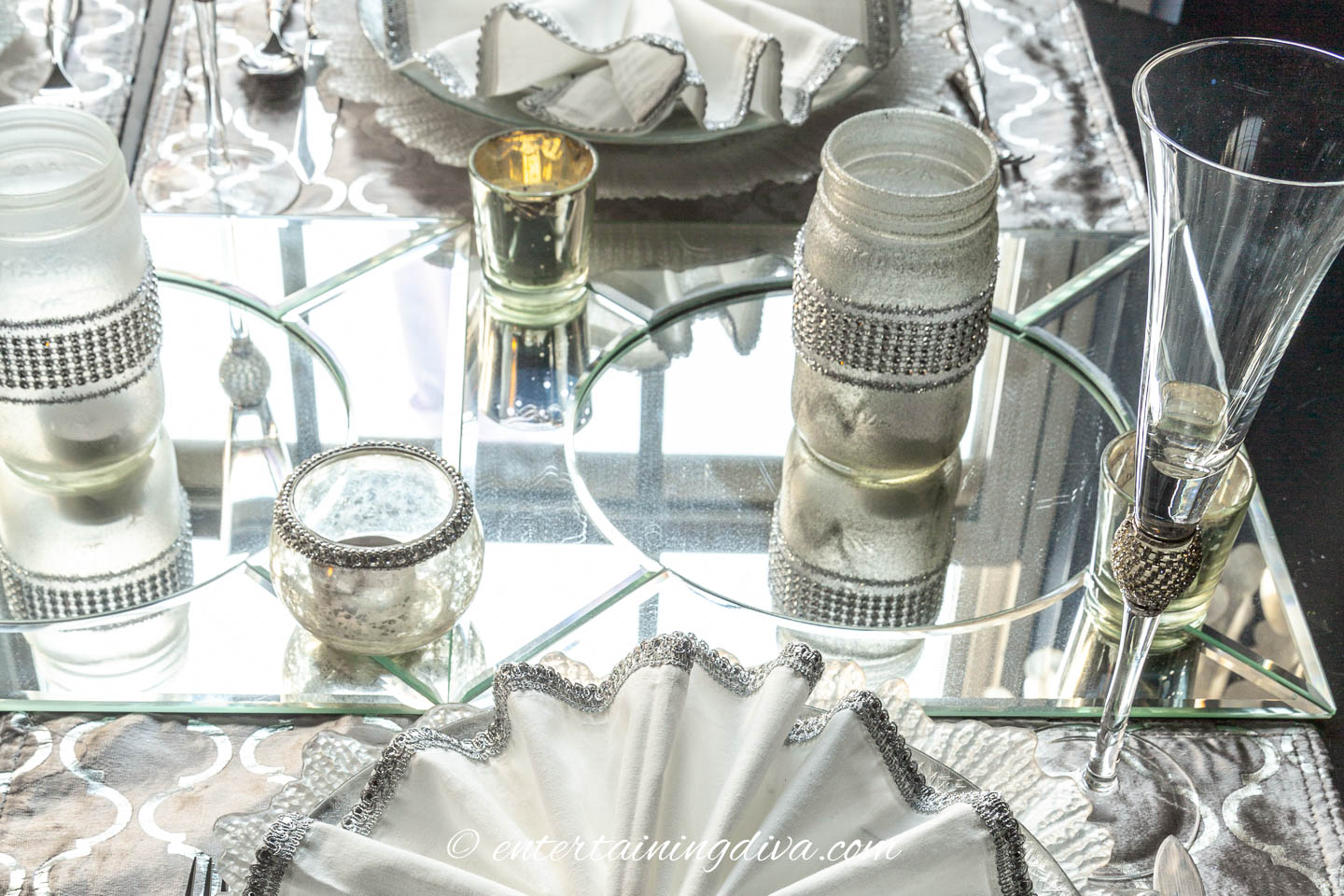 Mirror chargers work well under candles | Silver and White Winter Table Setting