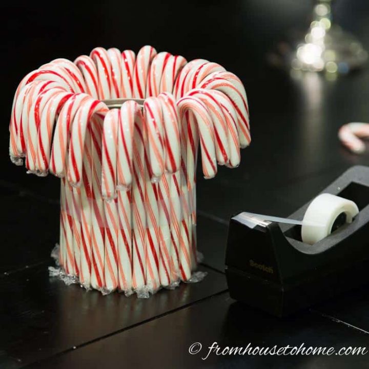 Wrap scotch tape around the candy canes to hold them in place