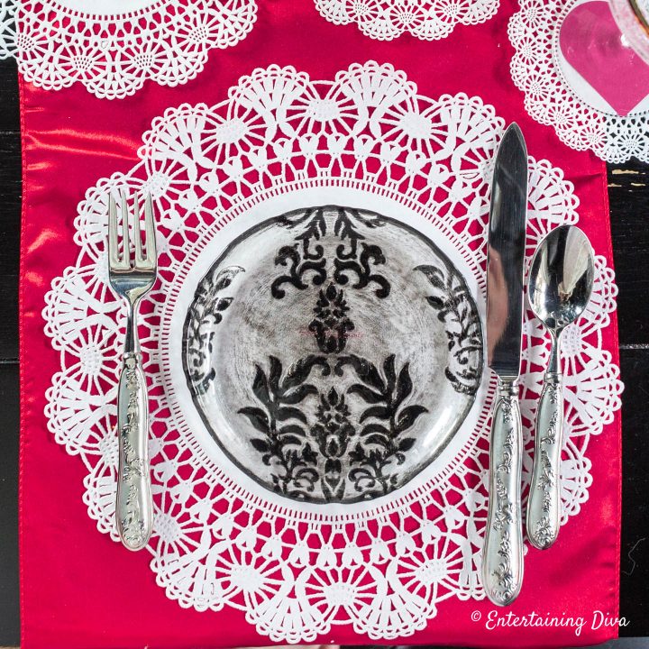 Valentine Day table decoration ideas using red runner and white doilies