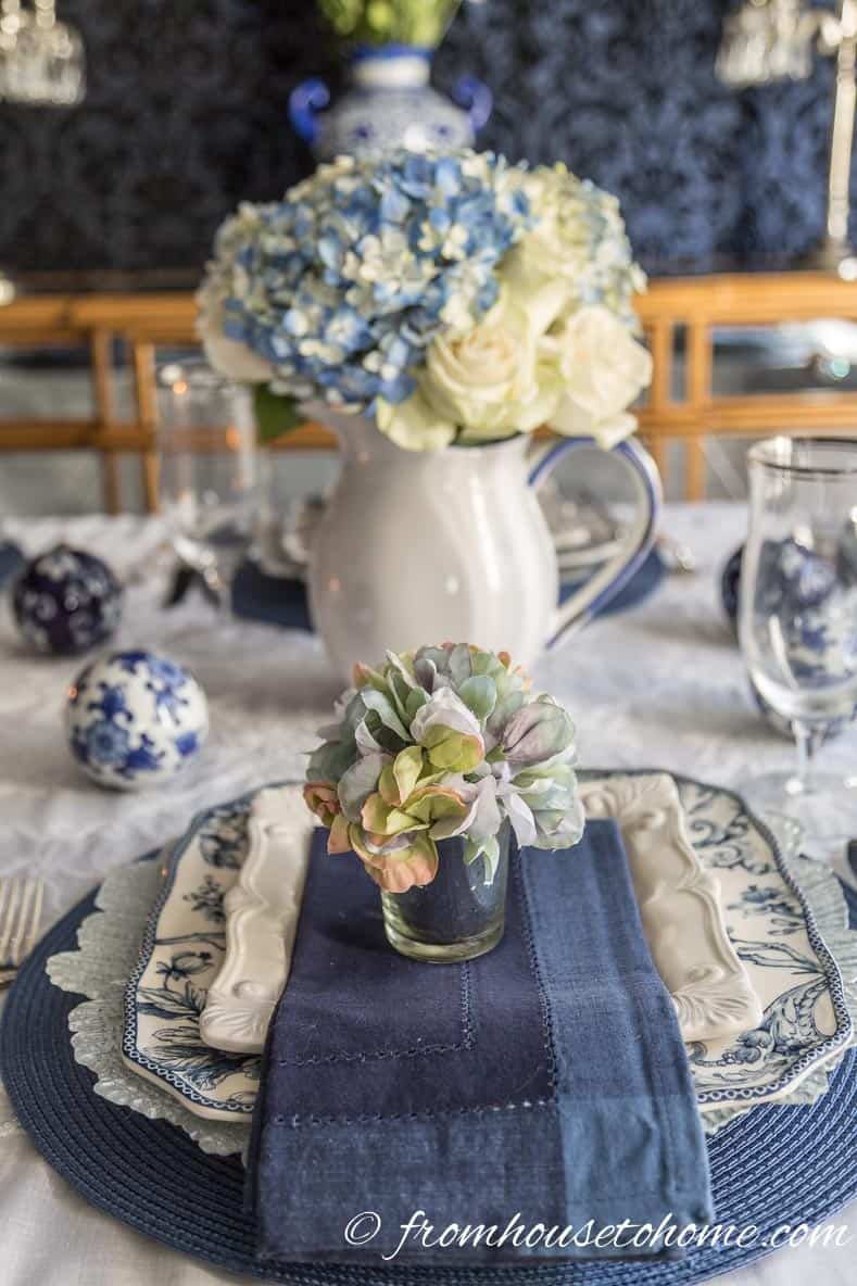  | Hydrangea-inspired Blue and White Tablescape | If you're looking for Easter dinner or spring table ideas, this blue and white table setting has a hydrangea centerpiece that is perfect for the occasion. The blue and white place setting is really pretty, too.