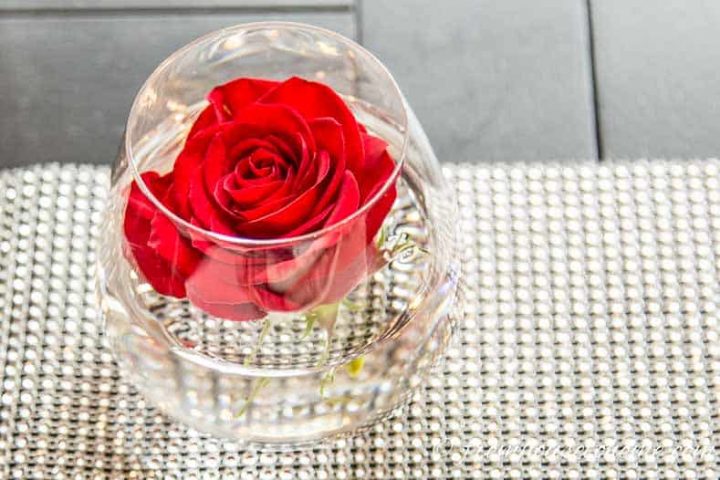 Brunch centerpiece made from a rose in a stemless wineglass