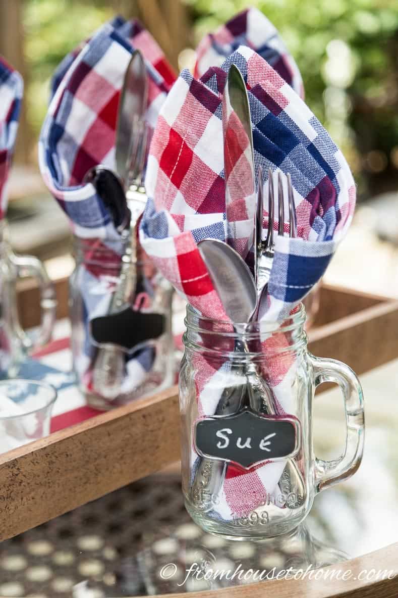 Cutlery and napkins in a mason jar is an easy way to serve for 4th of July bar-b-ques