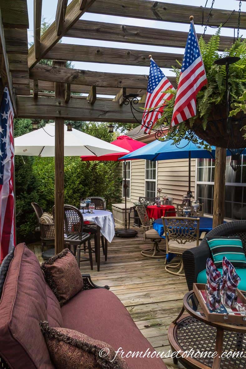 American flags co-ordinate with umbrella covers for more Easy Independence Day Outdoor Decor Ideas