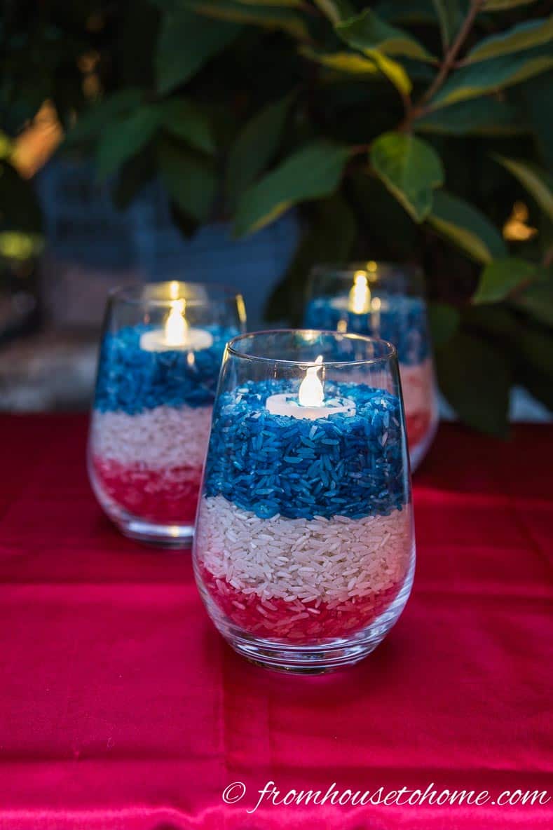 Dyed rice makes a red, white and blue patriotic candleholder for July 4th decor