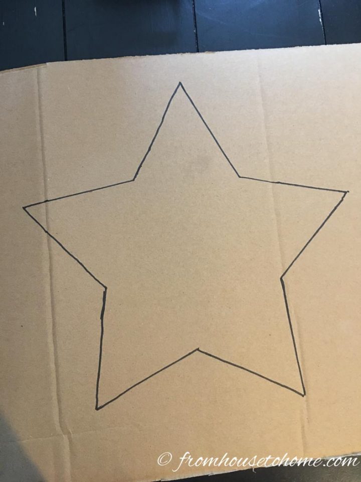 Square piece of cardboard with a star drawn on it