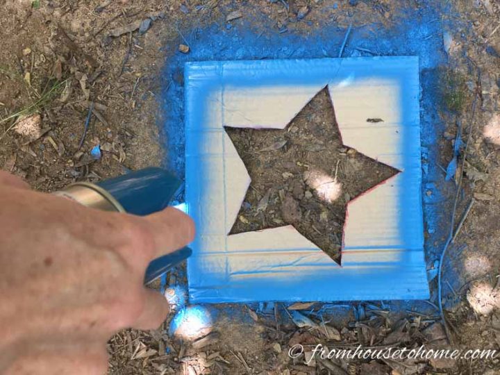 Blue spray paint outlining the star template
