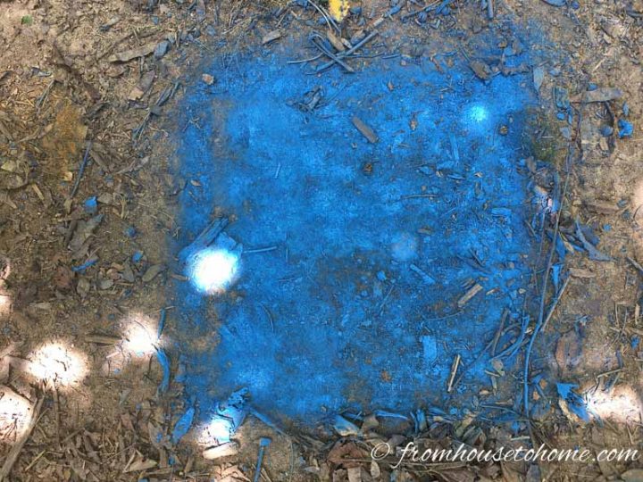 Filled in blue square made with spray paint on the ground