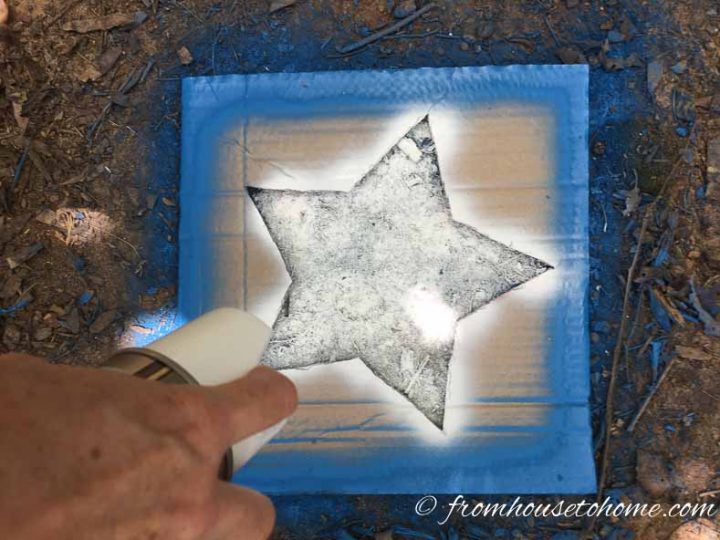 White star being painted in the middle of a blue square