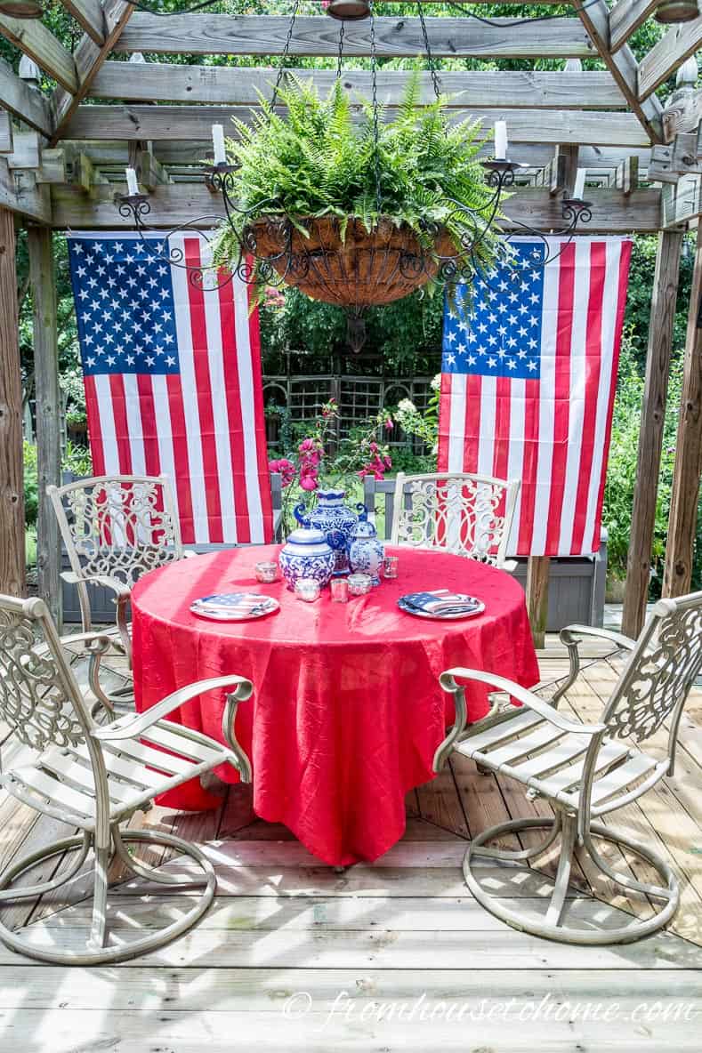 Hang flags sideways from the sides of the gazebo to act like curtains for easy 4th of july outdoor decorating ideas