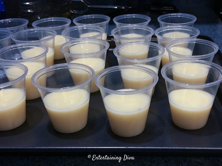 The strawberry shortcake jello shot layer in jello shot cups
