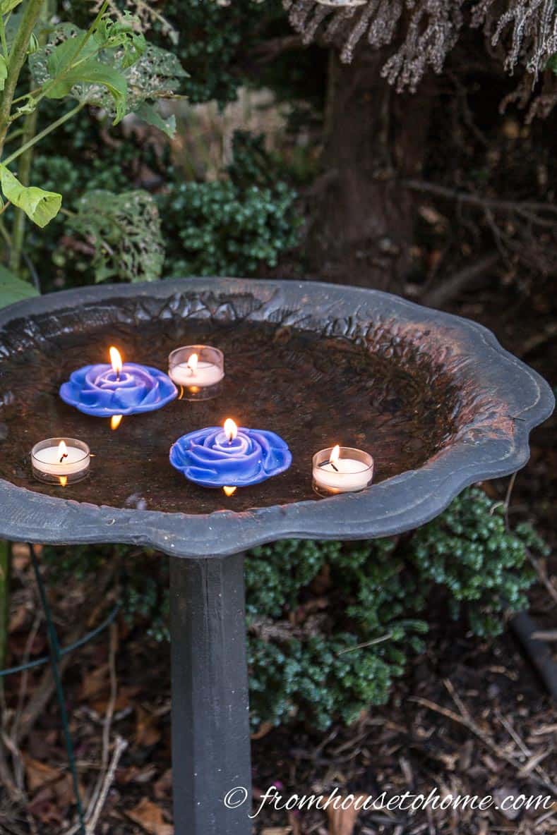 Float candles in a birdbath | 10 Creative Summer Party Ideas for easy entertaining | If you don't have a lot of time to spend decorating your backyard, these creative summer party ideas are fast and easy to do but still look beautiful.
