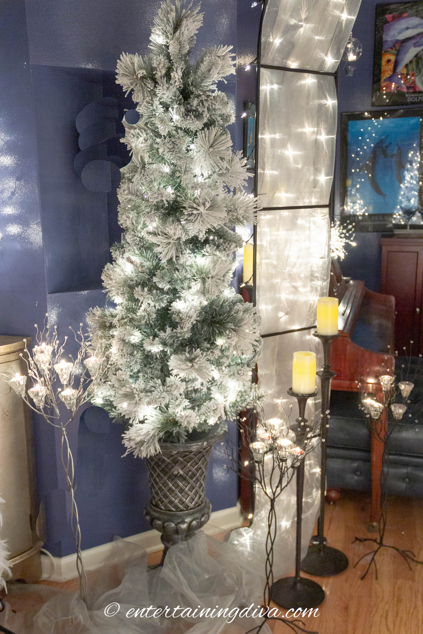 White flocked Christmas tree used for winter wonderland party decor