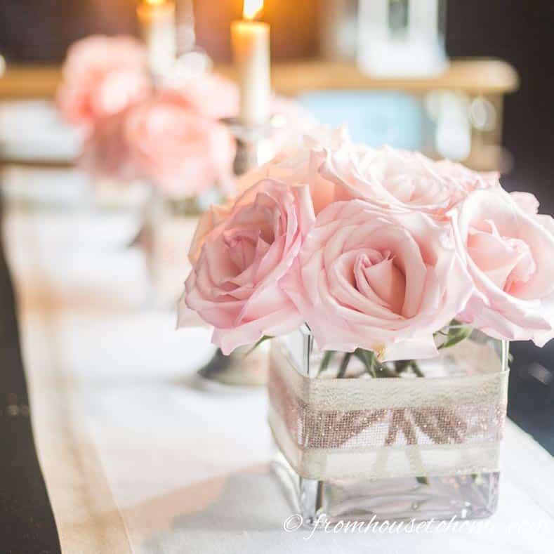 Valentine Day centerpiece with pink roses in glass vase