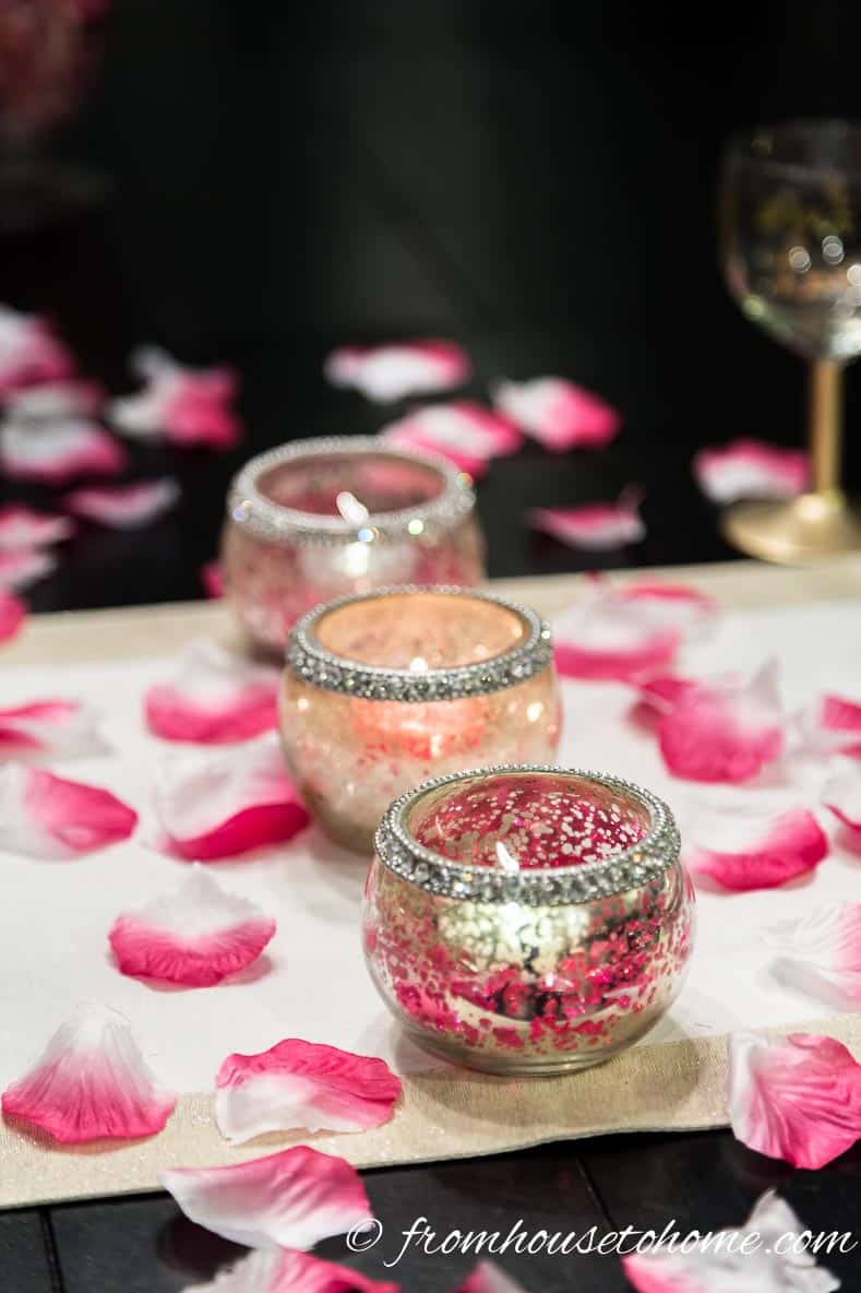 Candles and rose petals on a Valentine table