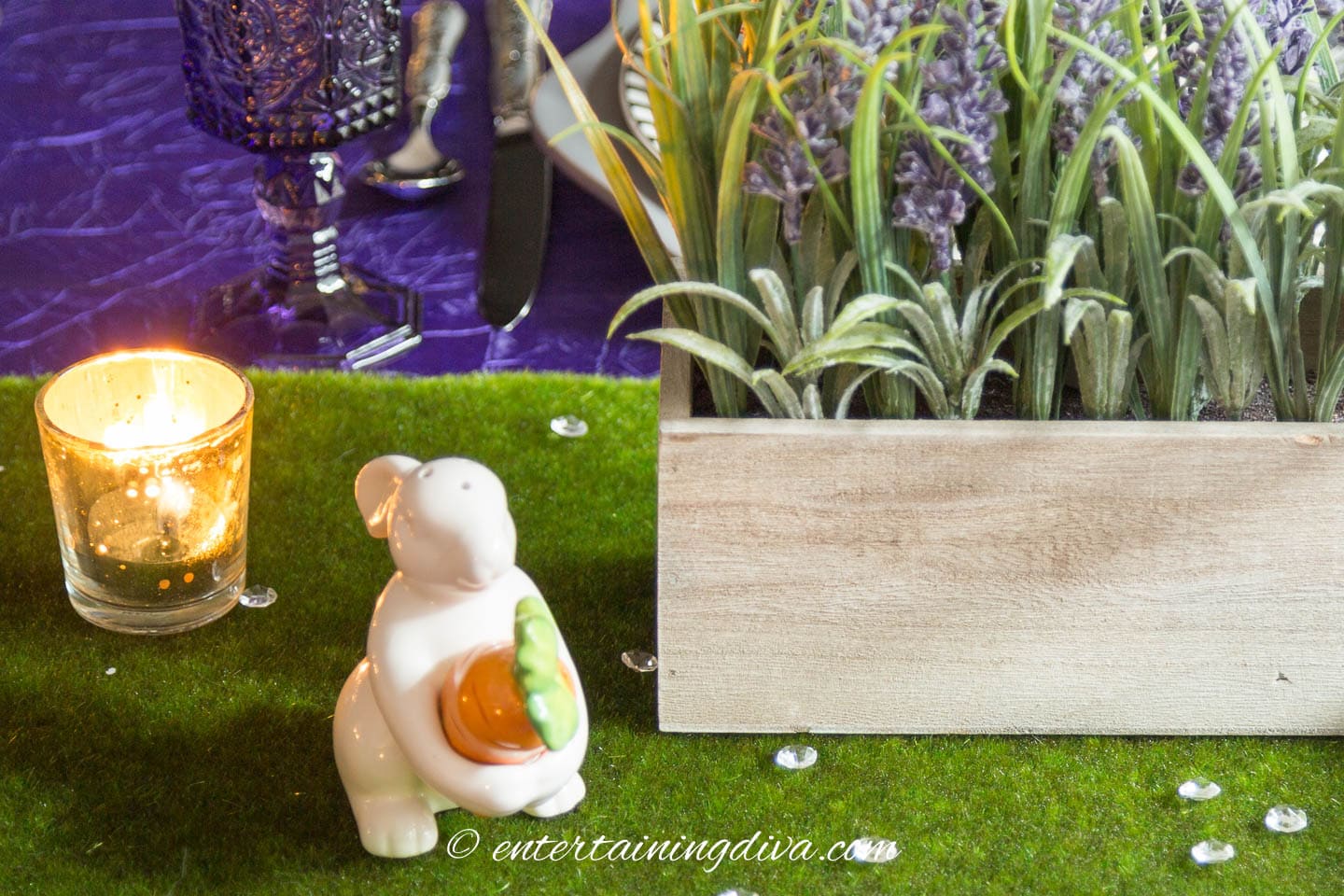 A bunny salt shaker on a purple and green Easter table