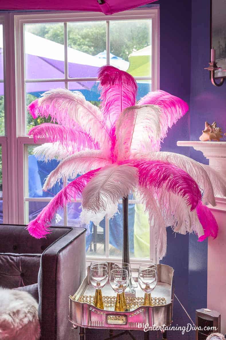 Alice In Wonderland pink and white ostrich feather centerpiece with a black vase