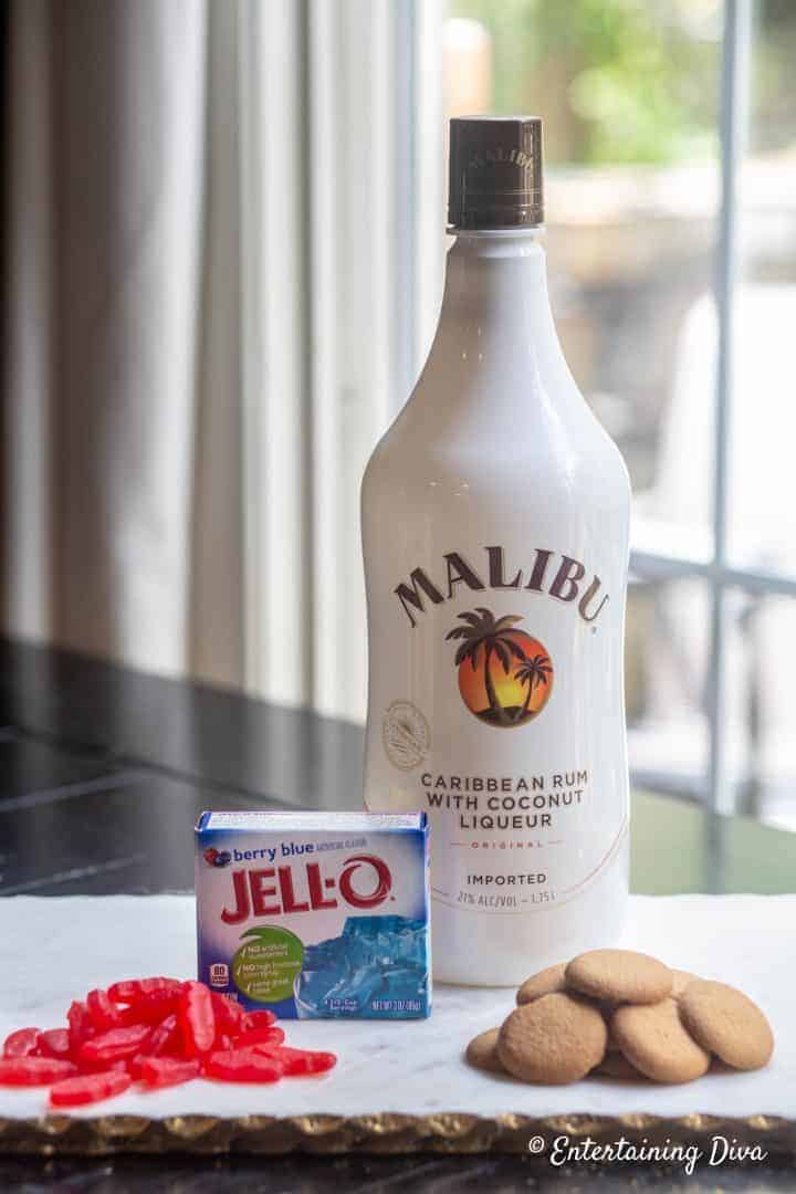 Under The Sea Swedish Fish jello shot ingredients - berry blue jello, malibu rum, swedish fish and vanilla wafers