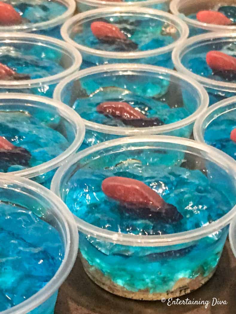 This 'under the sea' Swedish fish jello shot recipe with coconut rum is awesome! It is made with Malibu rum and is one of the best blue jello shots I've tried. #entertainingdiva #jelloshots #cocktailrecipe #summerfun #partyideas Under The Sea Swedish Fish Jello Shot Recipe