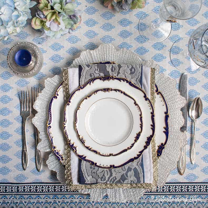 Blue and white place setting on a blue and white summer tablescape