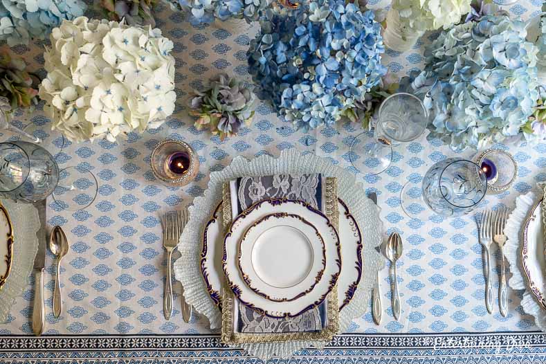 Blue and white place setting with blue and white hydrangeas