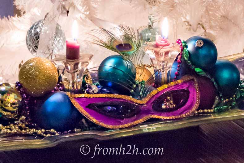 Masks, Christmas ornaments and Mardi Gras beads can be used as a centerpiece